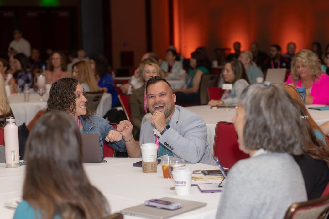 Audience laughing with the speaker