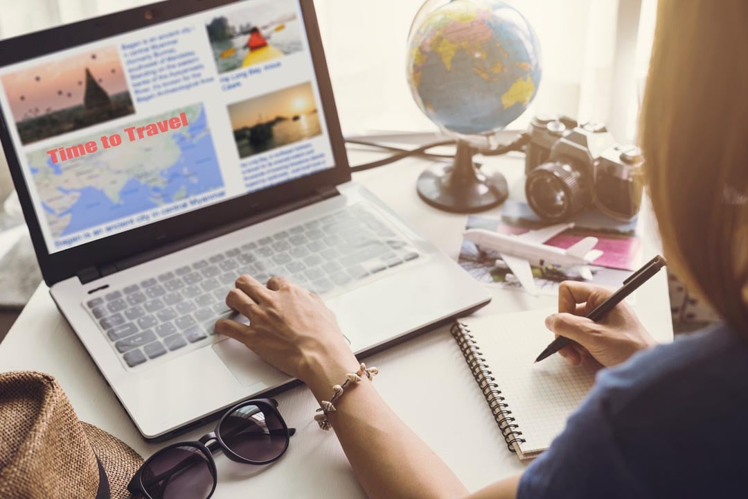 woman working on her travel website