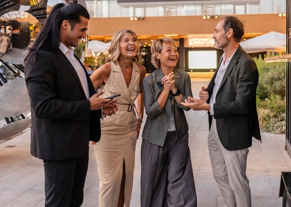 a group of four networking at an evening event