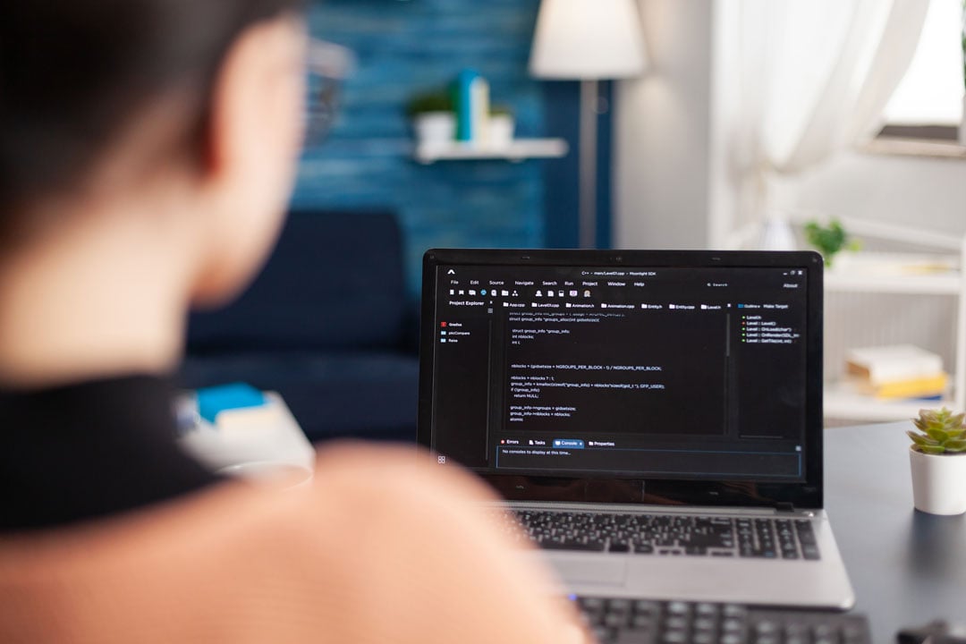 Woman Working on a Laptop at Home