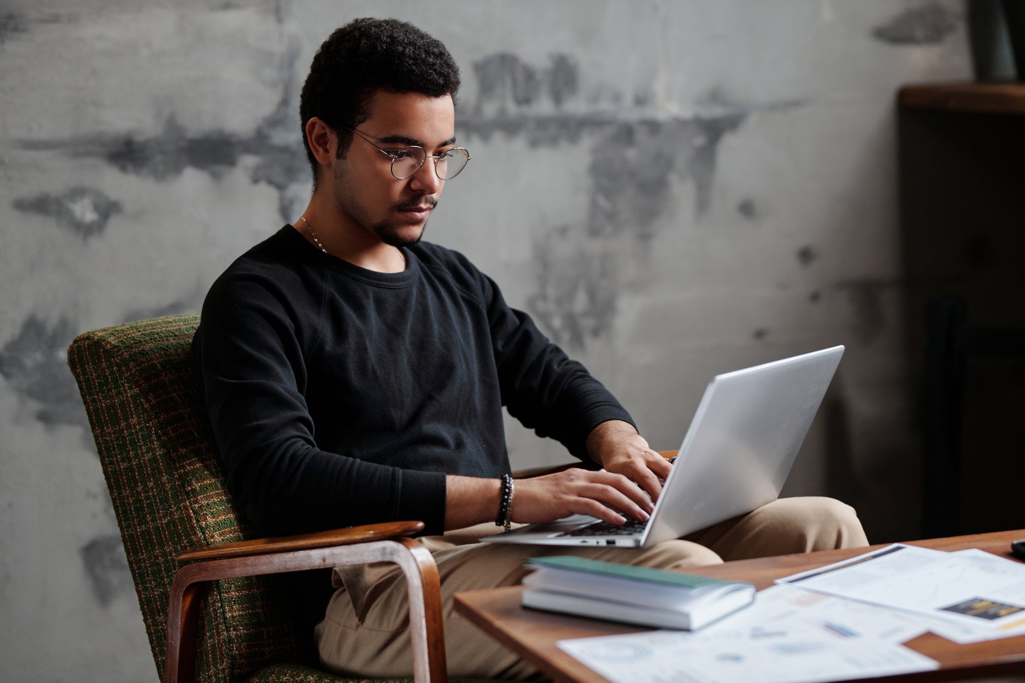 young-serious-businessman-with-laptop-on-his-knees-2023-11-27-05-08-44-utc