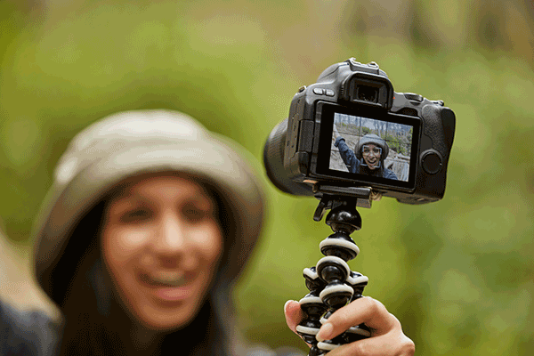 woman taking selfies while hiking in the wilderness