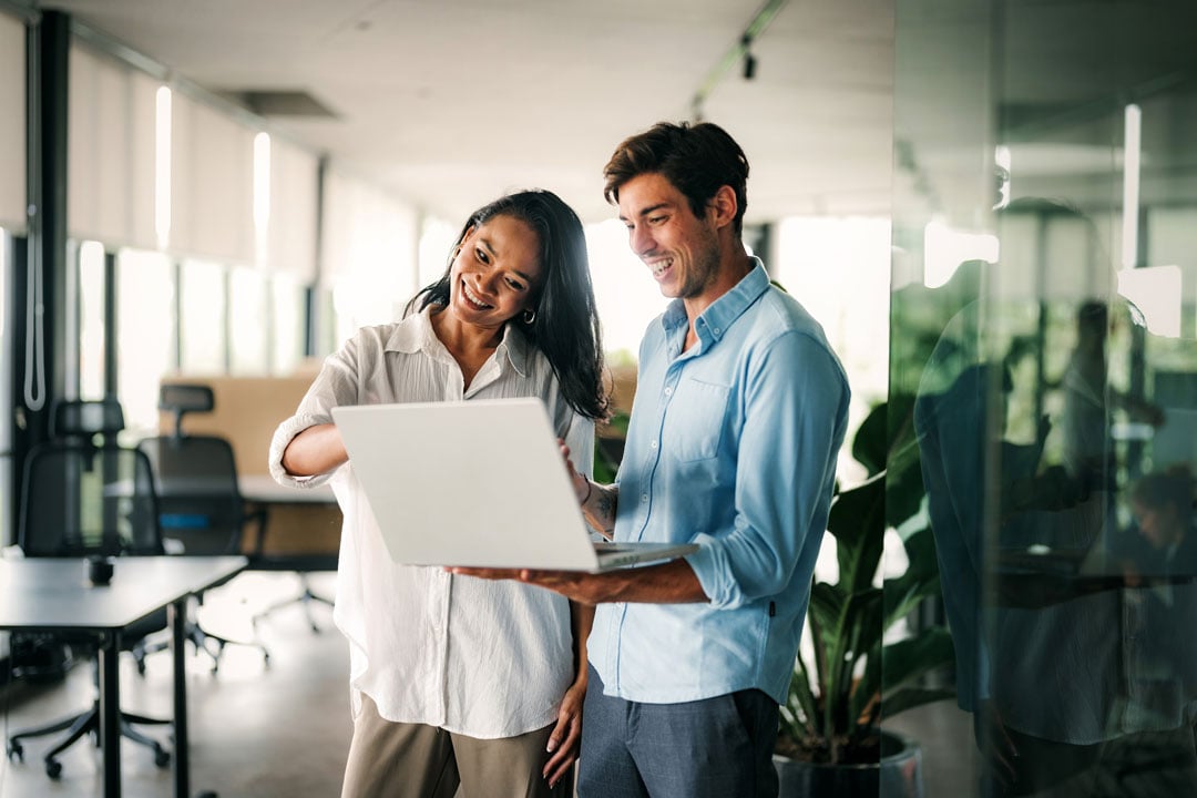 startup, business people working together on laptop computer in modern office