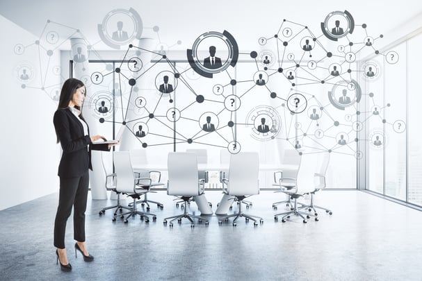 Young businesswoman standing in modern meeting room interior with daylight and abstract hologram. Future and media concept.