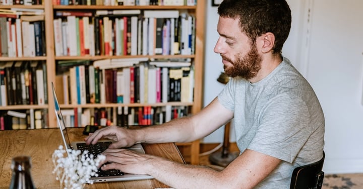 Man working from home on laptop at table
