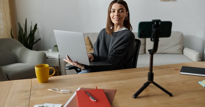 Woman working on laptop at her desk