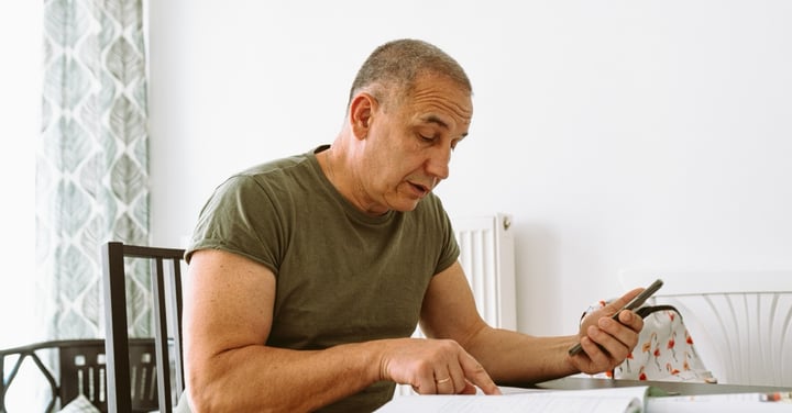 Mature man working at desk in a home