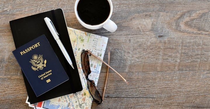 Planning a trip with map, passport and coffee