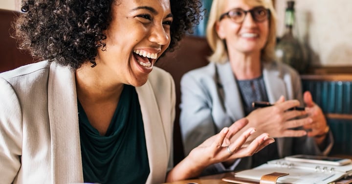 Business women laughing during a meeting