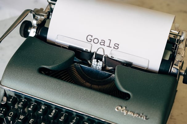 Typewrite with words Goals typed on a piece of paper
