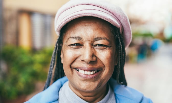 Happy woman smiling - WorldVia Travel Network