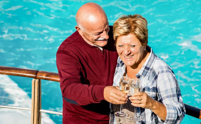 Happy senior retired couple having fun outdoors at travel vacation