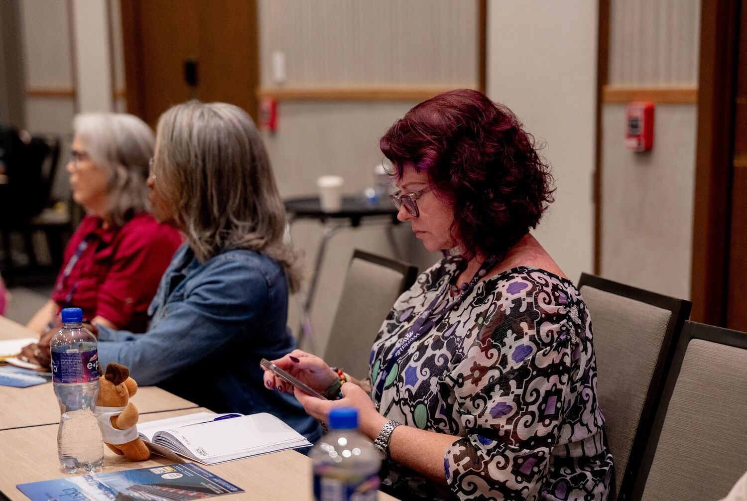 Advisors talking together around a table during an Accelerator session