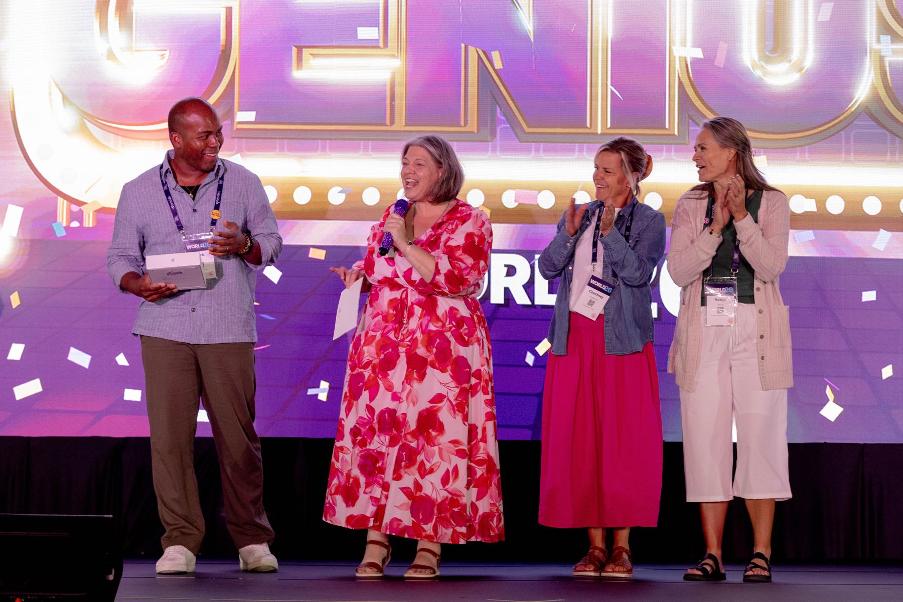 Members on stage during a WORLD26 general session