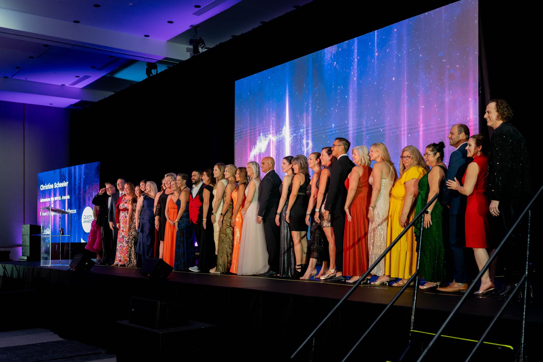 Questy honorees lined up across the WORLD26 stage